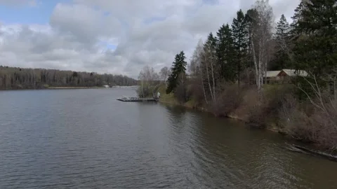 Drone gliding low above river coast Vidéo 330014060