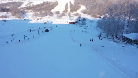 Drone gliding low above winter training ski slope Stock Footage 322641557