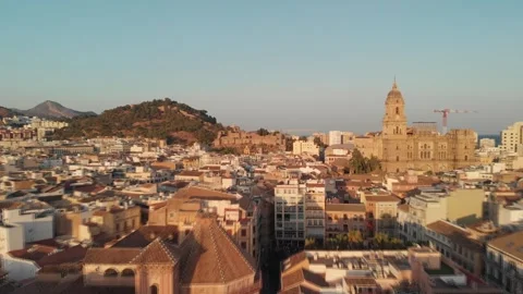 Drone gliding over historic Malaga rooftops at golden hour, showcasing anci.. Stock Footage 341828599