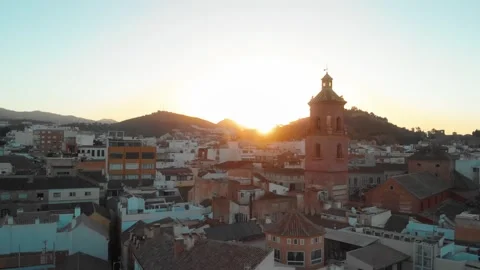 Drone gliding over Malaga's historic cityscape at golden hour, revealing an.. Stock Footage 344051973