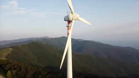 Drone gliding through wind farm on high mountain Stock Footage 322789475