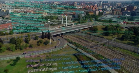 Drone gliding triggers code overlay scrolling across highway ramp and rail Stock Footage 311216690