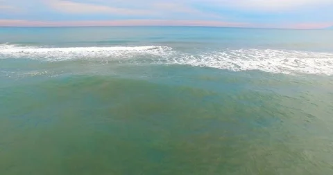 Drone Goes With Waves with Amazing Cloudy Sunset View, 4k Stock Footage 149863591
