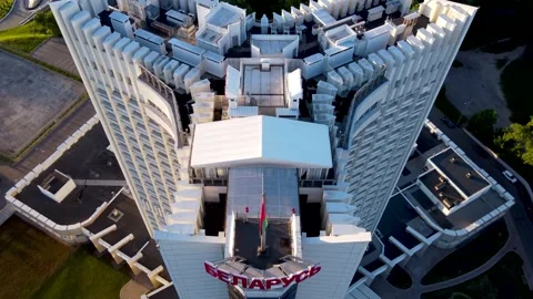 Drone going over hotel Belarus sigh in center of Minsk with belarussian flag Stock Footage 170375104