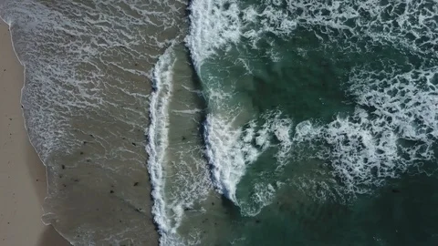 DRONE GOING INTO THE SEA BLUE WAVES Stock Footage 99830245