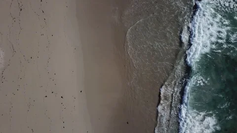 DRONE GOING INTO THE SEA BLUE WAVES Stock Footage 99830260