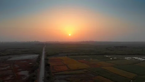 Drone going up at sunset time in a rural zone. Stock Footage 127688847