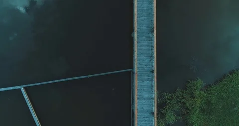 Drone Going Under Rusty Footbridge Over Icy River Stock Footage 126661403