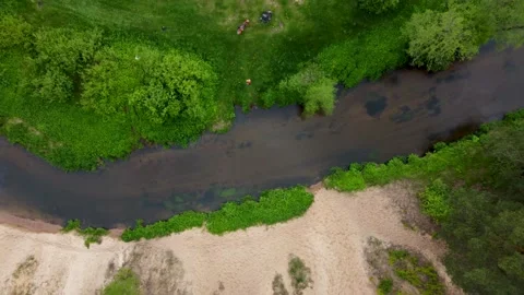Drone going upwards revealing u-turn of a wild river with meadow Stock Footage 169929115