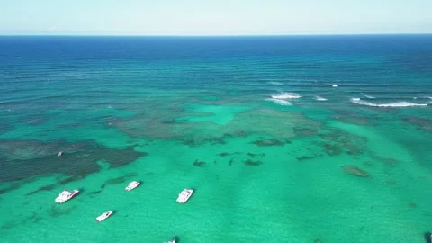 Drone gracefully glides above breathtaking coral barrier reef and yachts Stock Footage 272554088