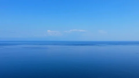 The drone gradually flies over the surface of the water. Lake Baikal, nature of Stock-Footage 124231398