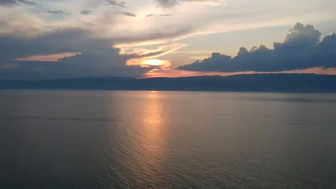 The drone gradually flies over the surface of the water. Lake Baikal, nature of Stock Footage 128320604