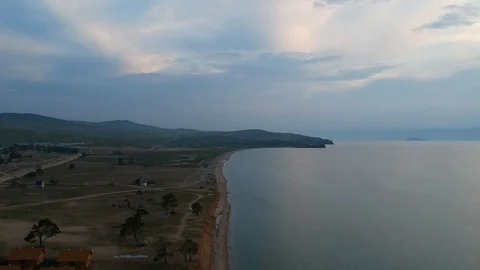 The drone gradually flies over the surface of the water. Lake Baikal, nature of Stock Footage 128321234