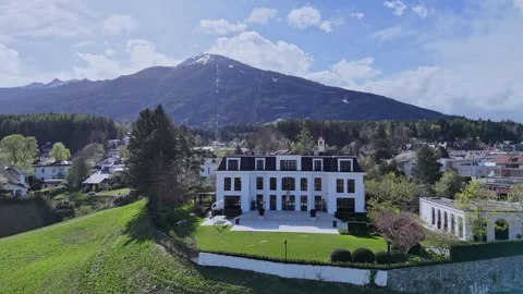 Drone Half-Circle Around Villa in Igls Tyrol Patscherkofel in the Background Stock Footage 308644548