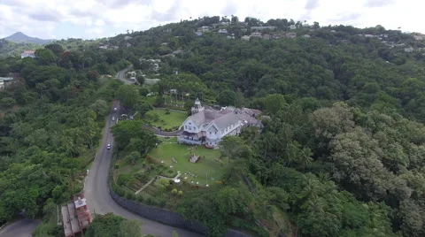Drone heading towards homes in mountain Stock Footage 63334987