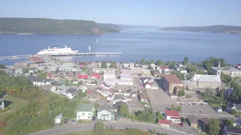 Drone high angle aerial seaside village push into cruise ship Stock Footage 169434749