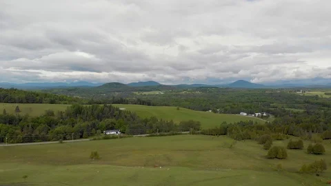 Drone high lateral moving view of quebec farmland in spring with cows, 4k Stock Footage 91153608