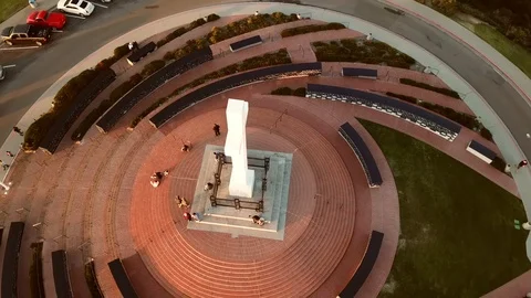 Drone high overhead circling Soledad Memorial Cross with a few tourists Stock Footage 85684204