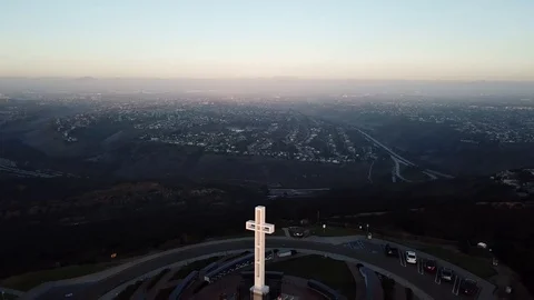 Drone high overhead circling Soledad Memorial Cross with a few tourists Stock Footage 85684227