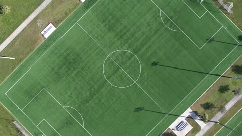 Drone is high overhead soccer fields and rotates clockwise. Stock Footage 311060298