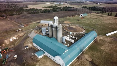 Drone high pullback view quebec dairy farm and house spring Stock Footage 93363024