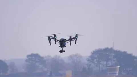 Drone with high resolution digital camera on blue sky Stock Footage 104252292