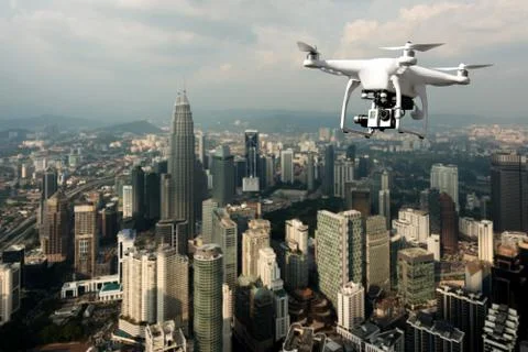 Drone with high resolution digital camera flying over Kuala Lumpur city at Ku Stockfoto's