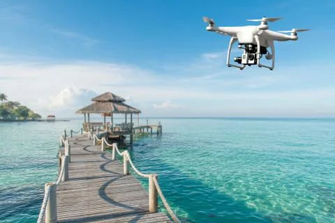 Drone with high resolution digital camera flying over tropical sea in backgro Stock Photos