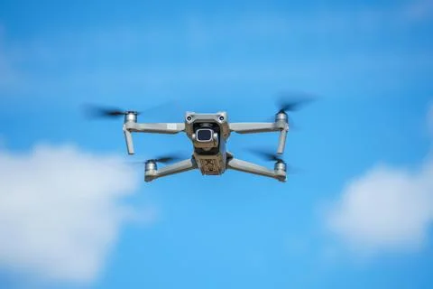 Drone with a high-resolution digital camera on a blue sky background Stock Photos