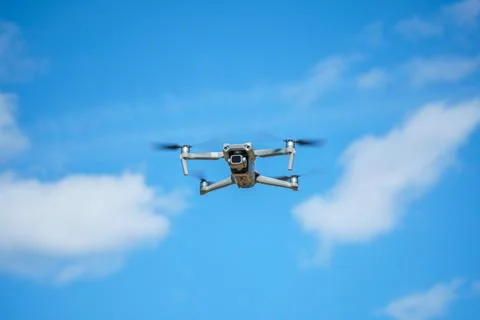 Drone with a high-resolution digital camera on a blue sky background Stock Photos