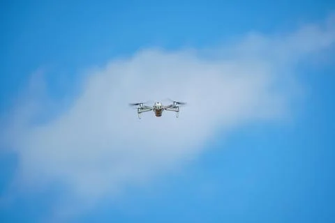 Drone with a high-resolution digital camera on a blue sky background Stock Photos