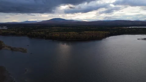 Drone High Up Shot of Lake During Evening Cloud Formations Stock Footage 287761984