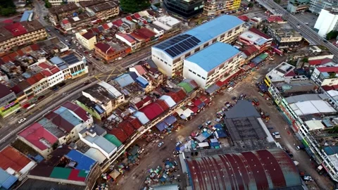 Drone highlights Pudu district with towering buildings and clustered houses Видео 332099702