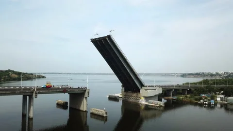 A drone hit a raised bridge over the river, for the safe passage  Stock Footage 196383804