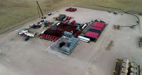 Drone hook shot over a fracking operation on the plains of Eastern Stock Footage 167396515