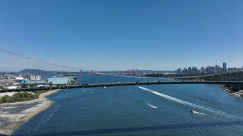 Drone Horizontal Dolly Across Lions Gate Bridge with Downtown Vancouver Sky.. Stock Footage 329819662