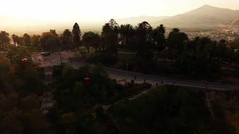 Drone Horizontal Tracking View of San Cristobal Park with Red Cable Cars at.. Stock Footage 339254185