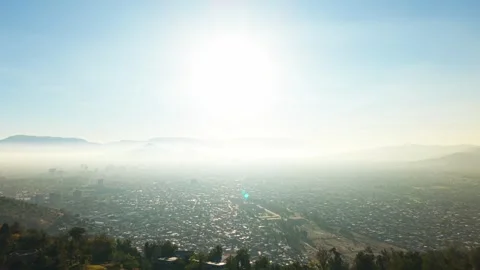 Drone Horizontal Zooming Out View of a Dense Smog and Haze Layer Over Santi.. Stock Footage 339254191
