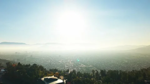 Drone Horizontal Zooming Out View Over San Cristobal Hill Towards a Pollute.. Stock Footage 339254197