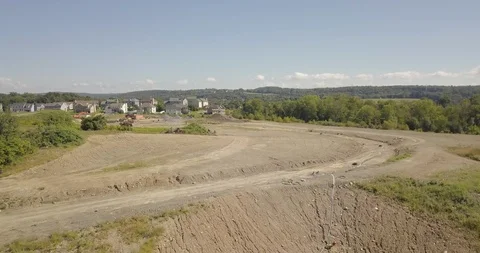 Drone of housing construction flat dirt outside rich development Stock Footage 95149531