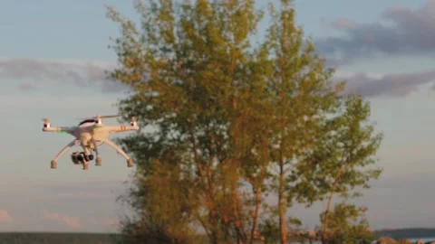 Drone hover in the sky slow motion professional quadcopter UAV camera movement Stock-Footage 141483077