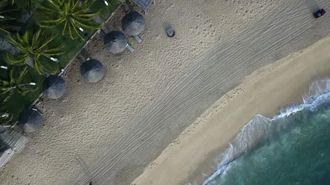 Drone hovering above beach section with palapas in Mexico Vídeo Stock 199820182