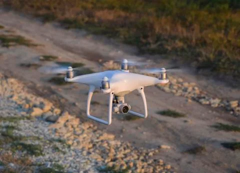 The drone, hovering above the ground Stock Photos