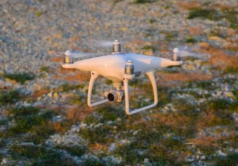 The drone, hovering above the ground Stock Photos