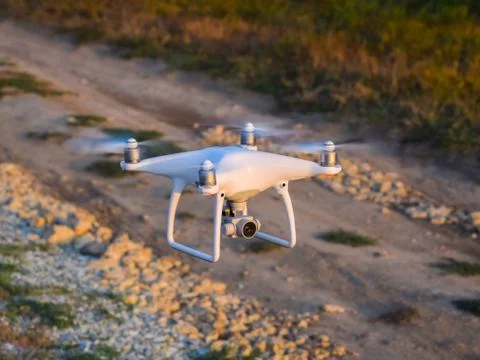 The drone, hovering above the ground Stock Photos