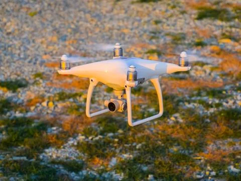 The drone, hovering above the ground Stock Photos