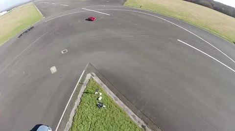 Drone hovering above racetrack 스톡 동영상 49586903