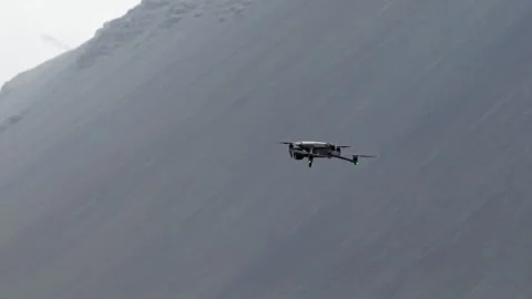 Drone hovering in front of steep volcanic mountain slope at Reynisfjall, Iceland Stock Footage 346190356