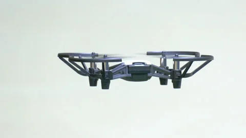 Drone hovering leaving frame upward Stock Footage 252095247