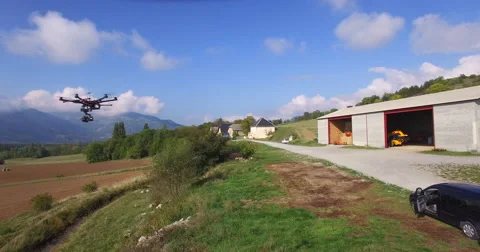 Drone hovering near field Stock Footage 64344708